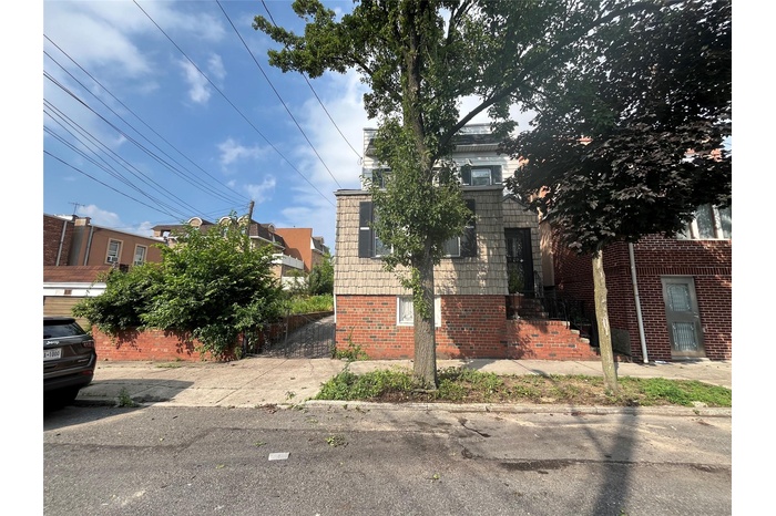 View of front of house with brick siding