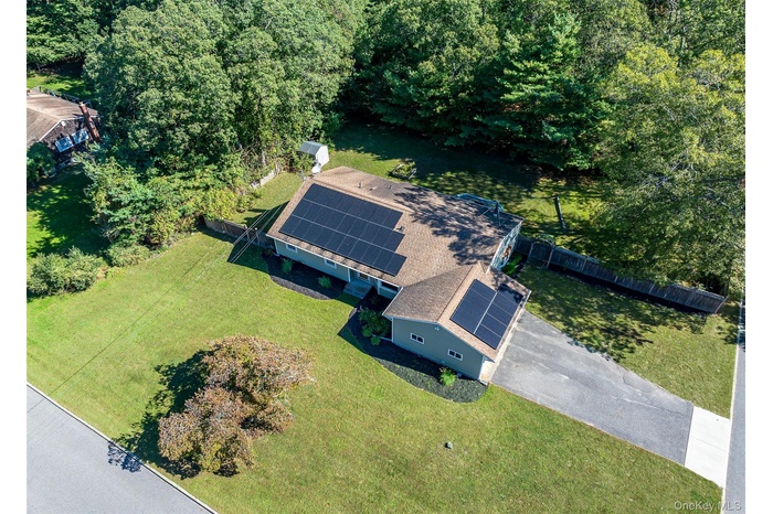 Birds Eye View Of .40 Acre Bordering County Property.