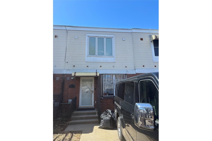 View of front of house featuring entry steps and brick siding