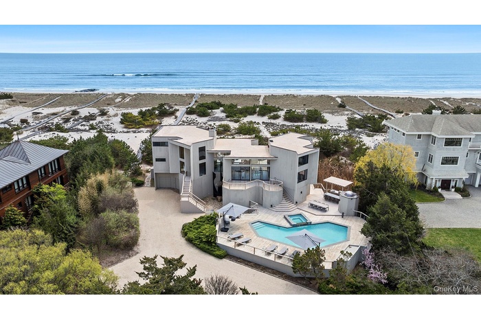 Aerial view with a water view and a beach view