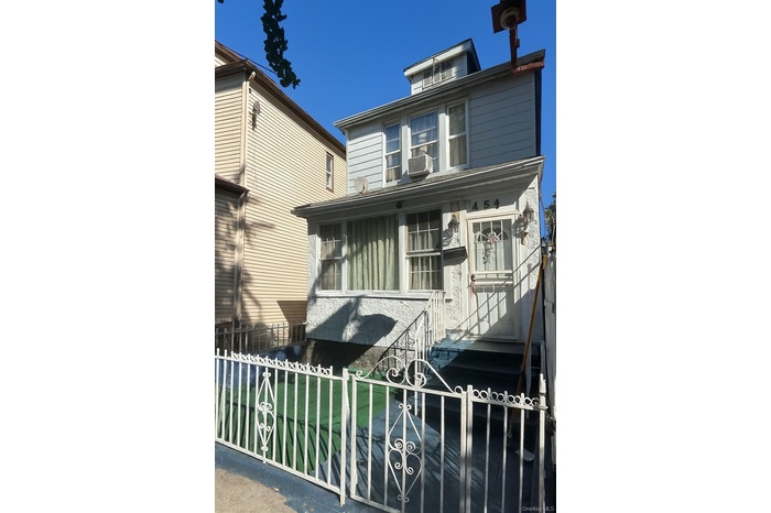 View of front of home with a fenced front yard