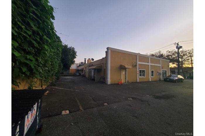 View of property at dusk