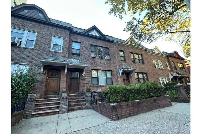 View of front of property featuring brick siding