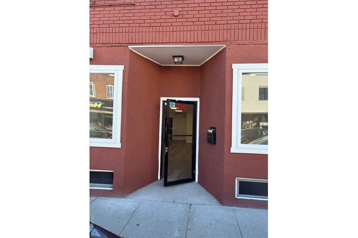 Entrance to property with stucco siding