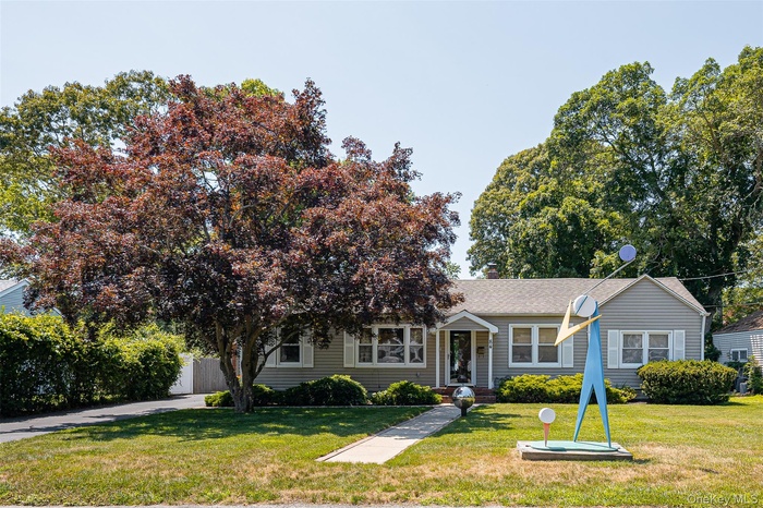 View of front of home featuring roof with shingles