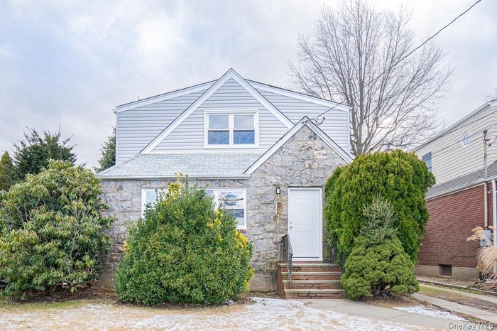 View of front of property featuring stone siding