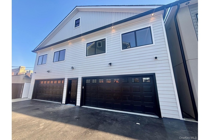 Garage featuring driveway
