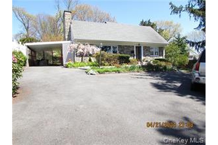 View of front facade with a carport