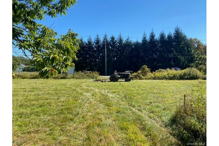 View of grassy yard with a view of countryside