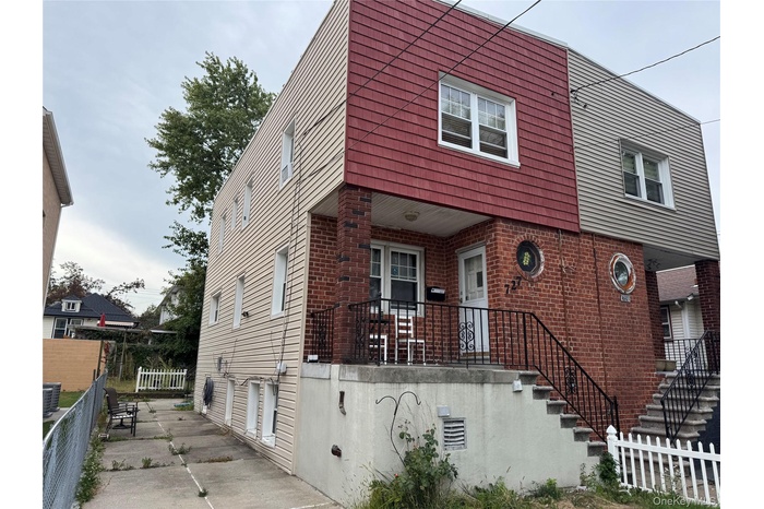 View of front of house featuring brick siding