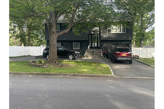 Raised ranch with circular driveway