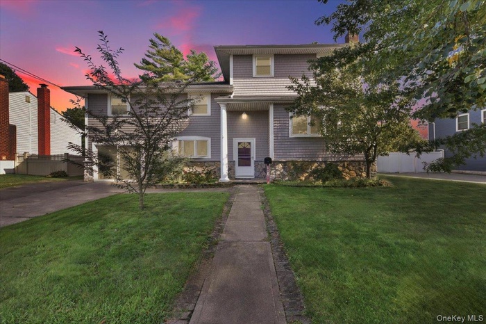 View of front of home featuring driveway