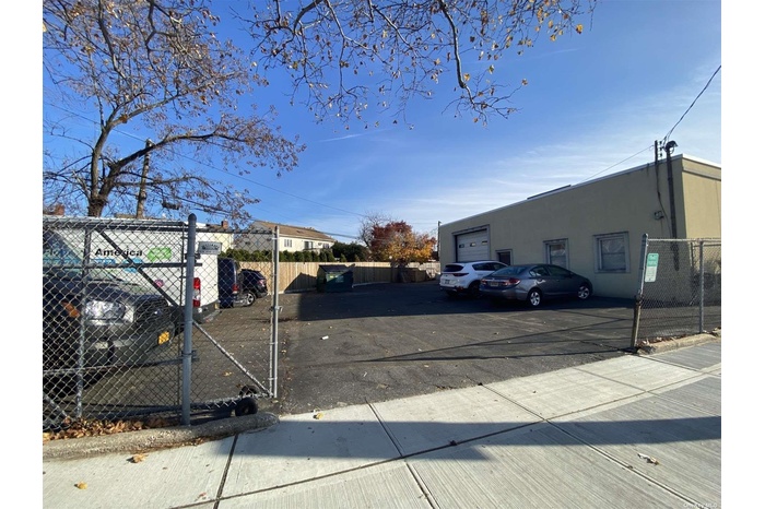 Gated Side Parking W/ Roll Up Door
