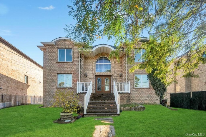Traditional-style house with brick siding