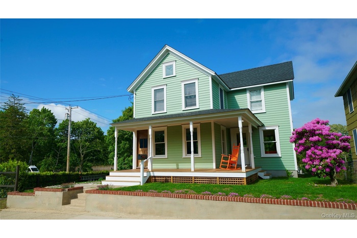 View of front of house with covered porch