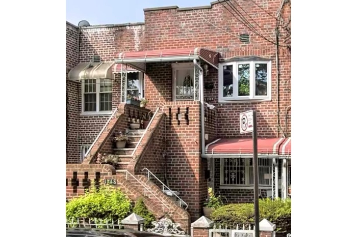 Rear view of house with brick siding