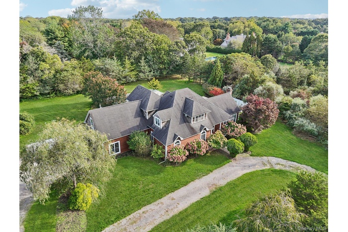 A stunning aerial view showcasing the property’s impressive front elevation and architectural presence.