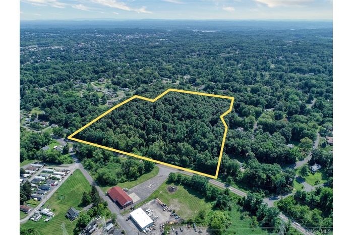 Aerial view of property and surrounding area with property boundaries highlighted