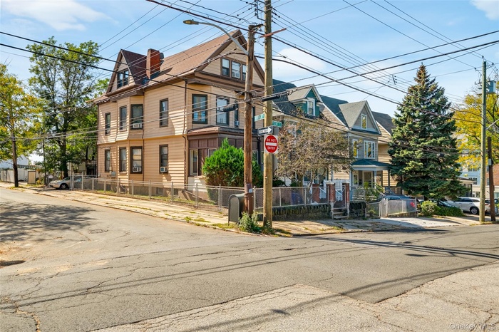 View of front of property featuring a fenced front yard and a residential view