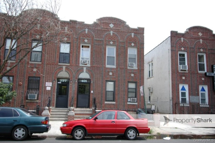 Traditional-style house featuring brick siding