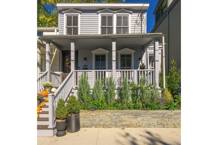View of front of property featuring covered porch