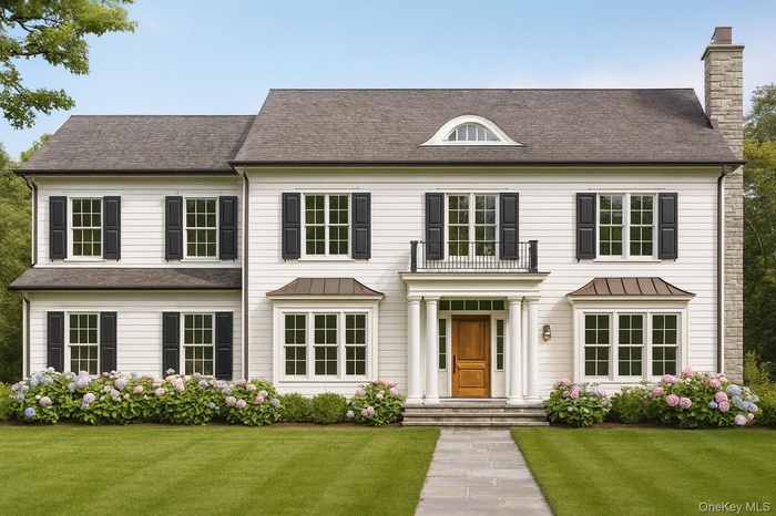 View of front of home featuring a front lawn, a chimney, a standing seam roof, and a metal roof
