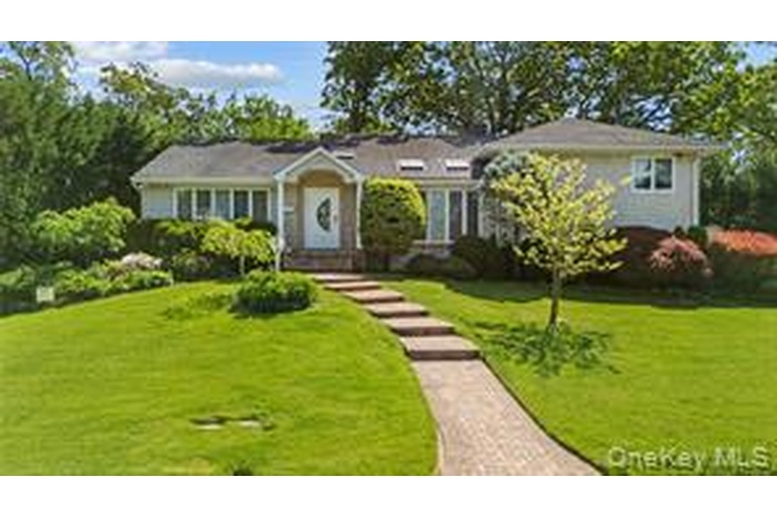 View of front of house with a front lawn