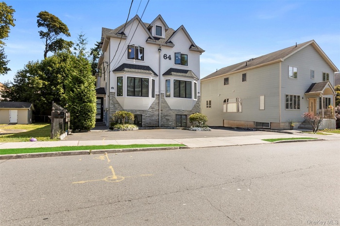 View of front of house with stucco siding