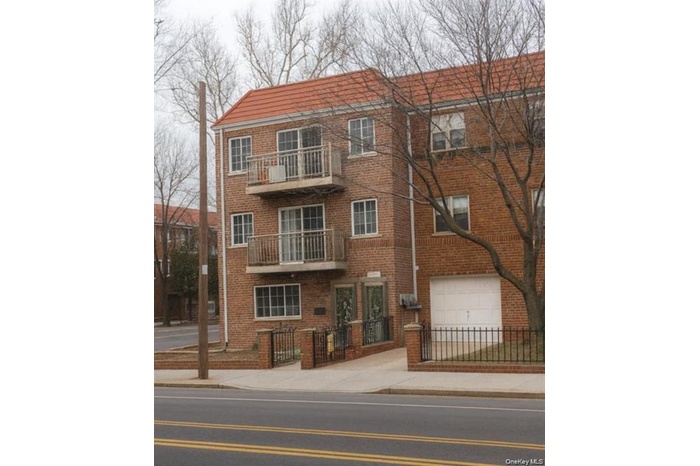 View of building exterior with a fenced front yard