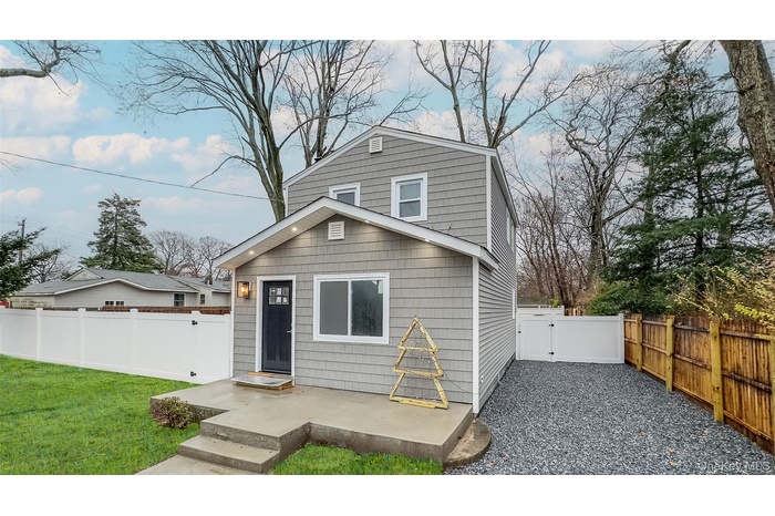 View of front of house with a front lawn