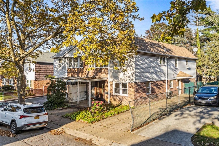 View of front of house featuring brick siding