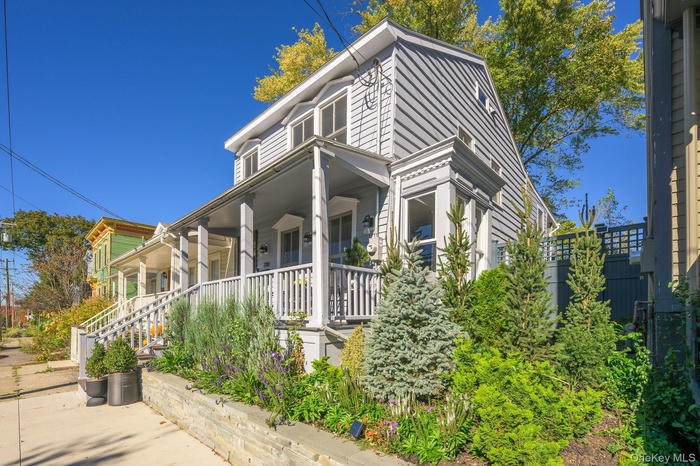 View of front of house with covered porch