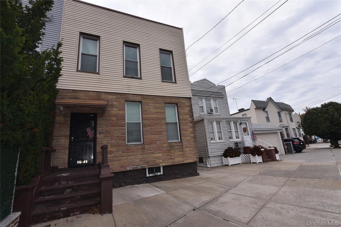 View of front of home with stone siding