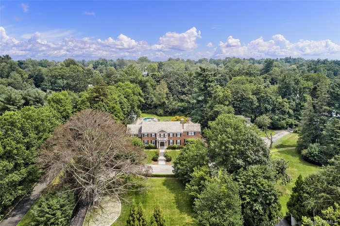 View of subject property featuring a forest