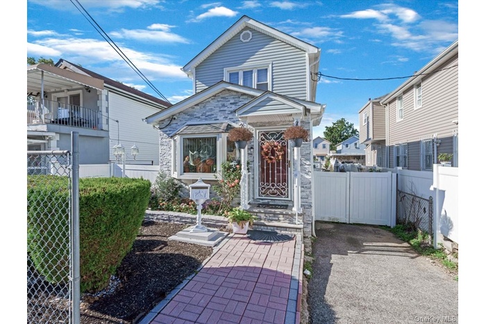 View of front facade featuring a gate