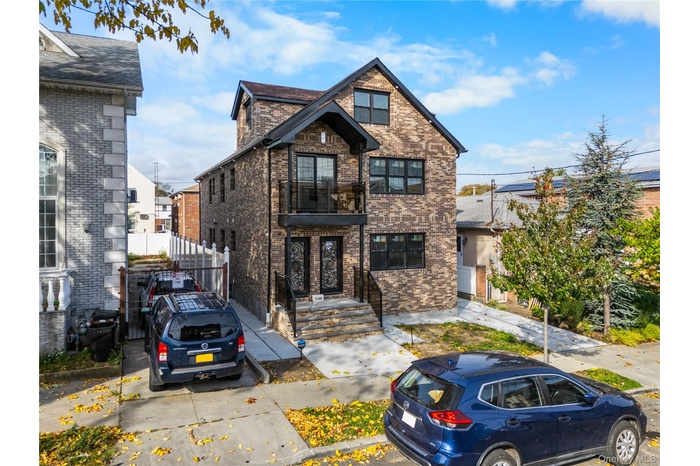 View of front of house featuring brick siding