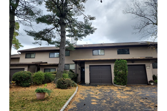 Traditional-style home with driveway and a garage