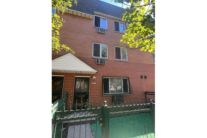 Front Entrance through fenced front yard.