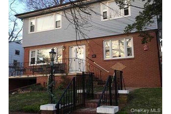 View of front of house with brick siding