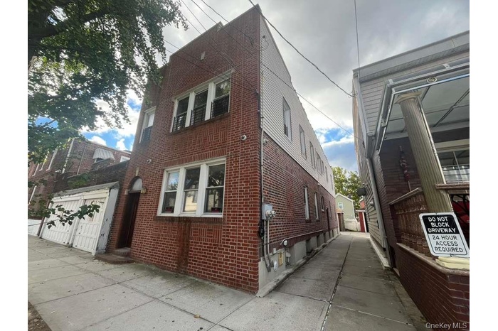 View of side of home with brick siding