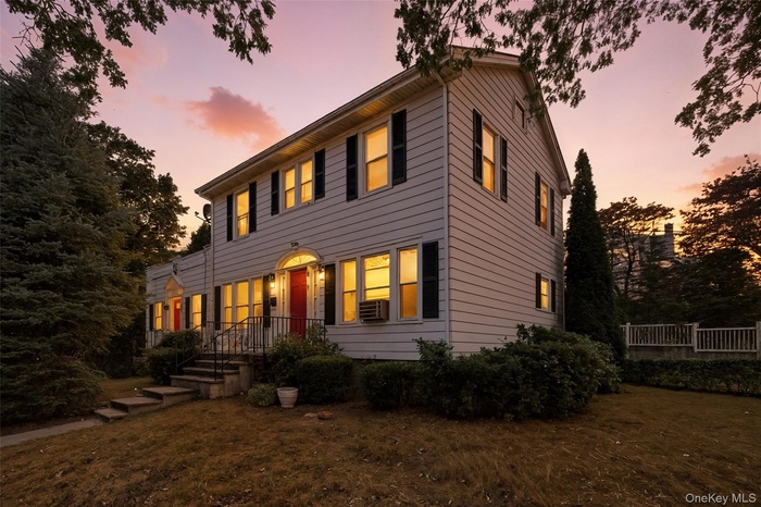 Colonial home with a front lawn