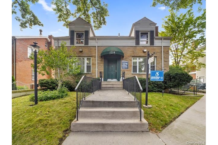 View of front of property with brick siding