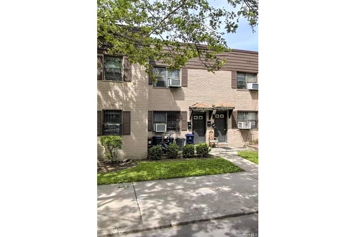 Traditional home featuring brick siding