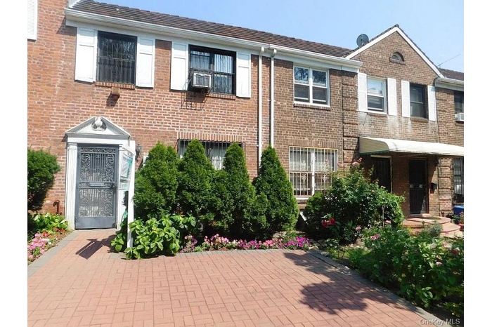 View of front of home featuring brick siding
