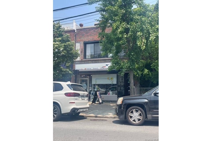 View of front facade featuring brick siding