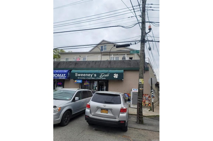 View of commercial location with uncovered parking