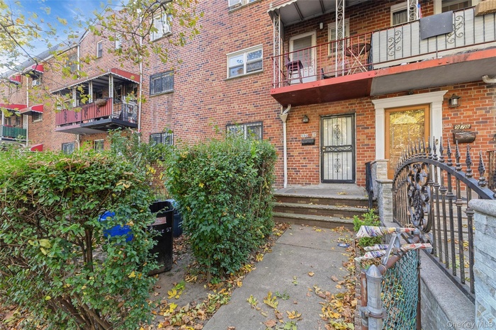 View of exterior entry with brick siding