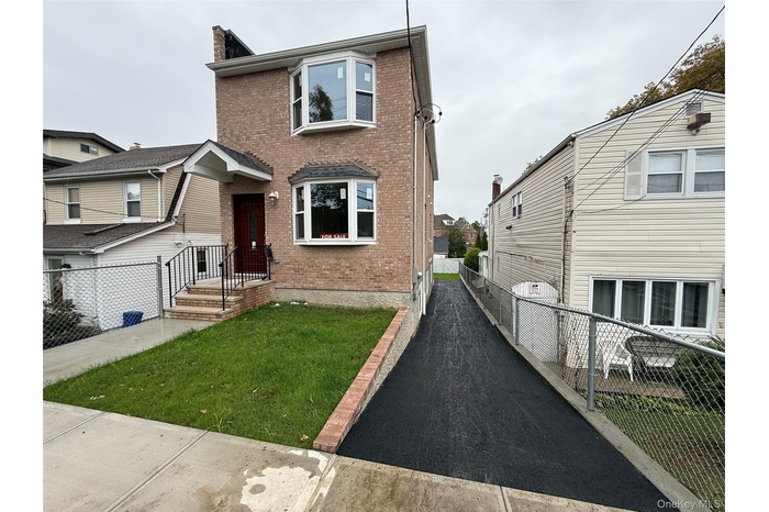 Traditional-style home with brick siding