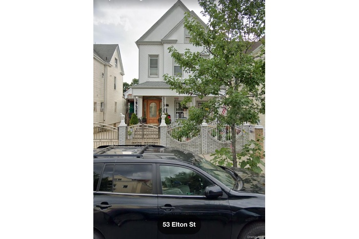 Victorian-style house featuring a fenced front yard