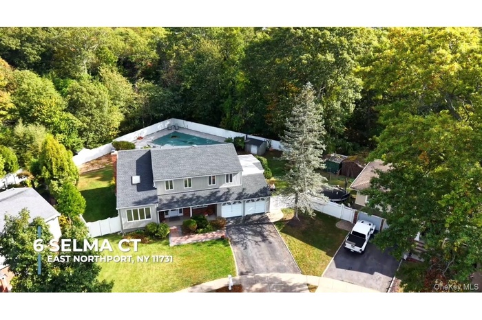 View from above of property with a forest